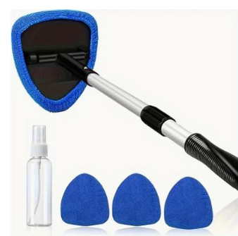 Cleaning car windshield glass with blue brush
