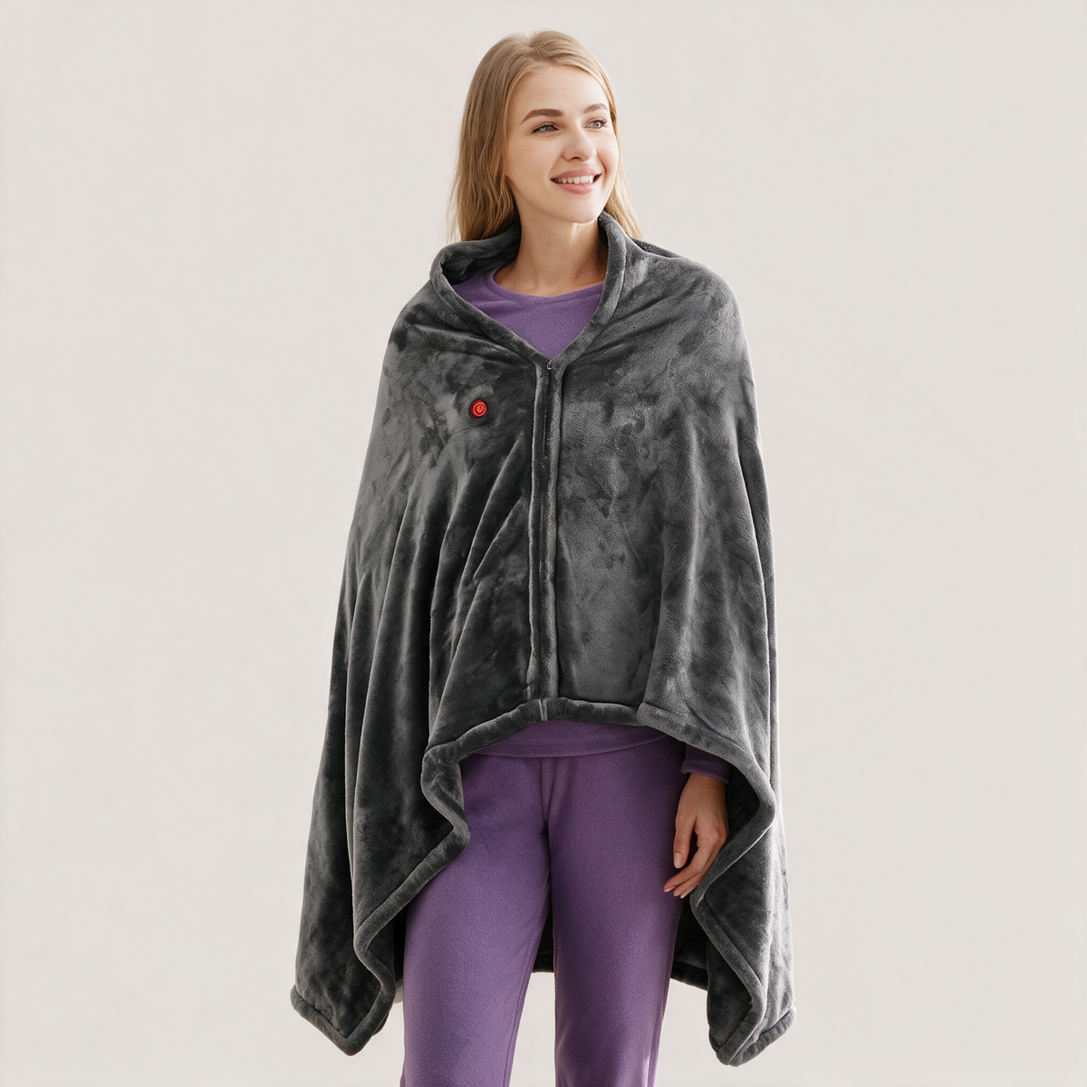 Woman wearing the dark grey heated wearable shawl with front zipper